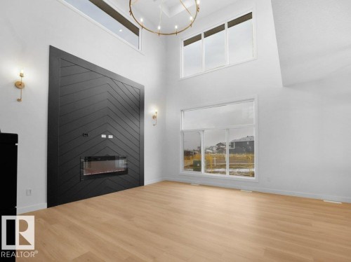 3305 Chernowski Way Sw, Edmonton, AB - Indoor Photo Showing Other Room With Fireplace