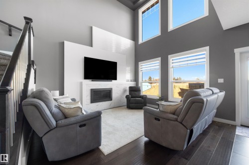 4915 38 Street, Beaumont, AB - Indoor Photo Showing Living Room With Fireplace