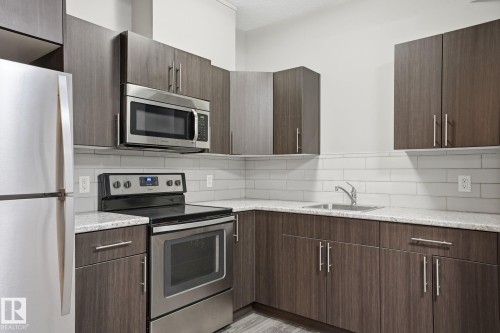 130 Harvest Ridge Drive, Spruce Grove, AB - Indoor Photo Showing Kitchen With Stainless Steel Kitchen With Upgraded Kitchen