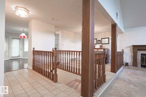 52 Blue Quill Crescent Nw, Edmonton, AB - Indoor Photo Showing Other Room With Fireplace