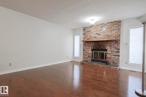 52 Blue Quill Crescent Nw, Edmonton, AB - Indoor Photo Showing Living Room With Fireplace