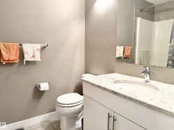 Bathroom featuring vanity, a shower with shower curtain, and light tile patterned floors - 