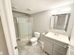 Full bath featuring vanity and a shower stall - 