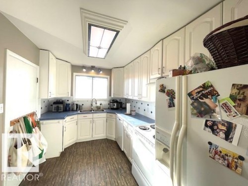 4723 103 Avenue, Edmonton, AB - Indoor Photo Showing Kitchen With Double Sink
