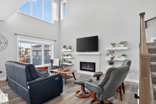 4301 38A Street, Beaumont, AB - Indoor Photo Showing Living Room With Fireplace