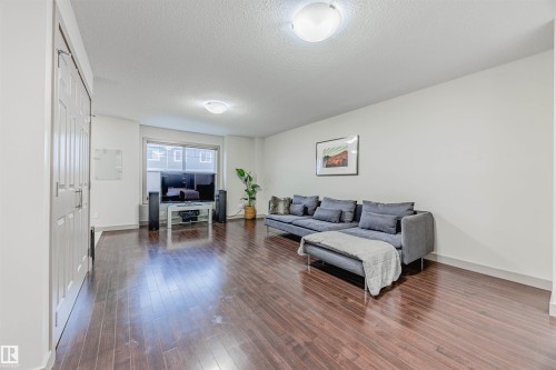 16 1150 Windermere Way, Edmonton, AB - Indoor Photo Showing Living Room