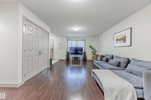 16 1150 Windermere Way, Edmonton, AB - Indoor Photo Showing Living Room