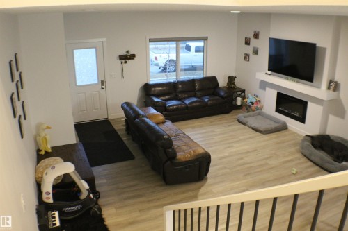 621 Blacks Stone Boulevard, Leduc, AB - Indoor Photo Showing Living Room With Fireplace