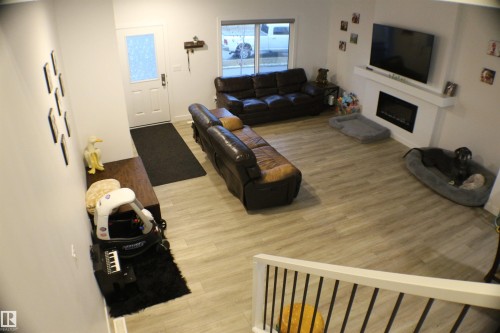 621 Blacks Stone Boulevard, Leduc, AB - Indoor Photo Showing Living Room With Fireplace