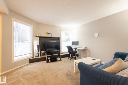 Office featuring a textured ceiling and light carpet - 3530 42 Street, Edmonton, AB - Indoor
