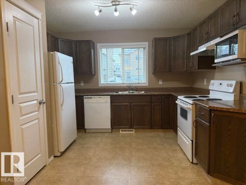 36 Vivian Way, Spruce Grove, AB - Indoor Photo Showing Kitchen With Double Sink