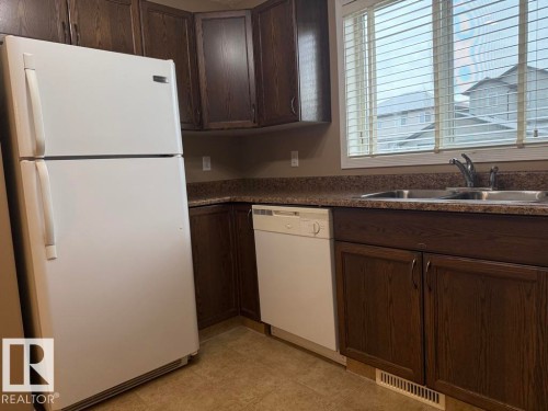 36 Vivian Way, Spruce Grove, AB - Indoor Photo Showing Kitchen With Double Sink