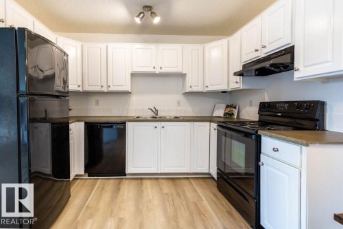 52 10208 113 Street, Edmonton, AB - Indoor Photo Showing Kitchen With Double Sink