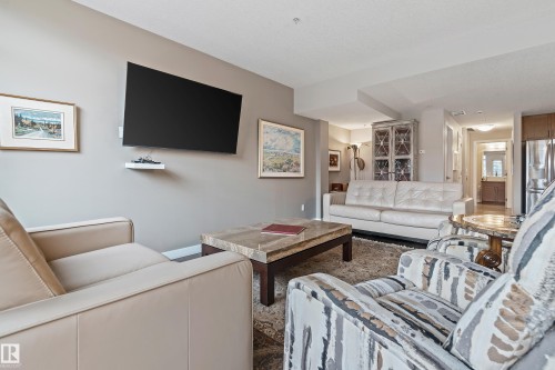 101 5151 Windermere Boulevard, Edmonton, AB - Indoor Photo Showing Living Room