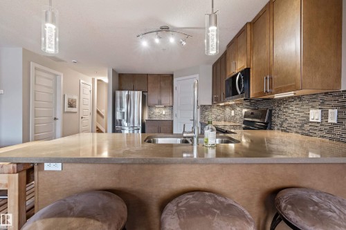 101 5151 Windermere Boulevard, Edmonton, AB - Indoor Photo Showing Kitchen With Double Sink With Upgraded Kitchen