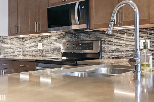 101 5151 Windermere Boulevard, Edmonton, AB - Indoor Photo Showing Kitchen With Double Sink With Upgraded Kitchen