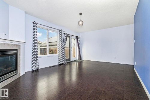 7822 Schmid Place, Edmonton, AB - Indoor Photo Showing Living Room With Fireplace