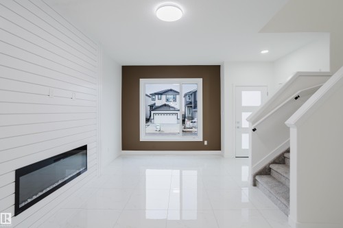 4113 67 Street, Beaumont, AB - Indoor Photo Showing Other Room With Fireplace