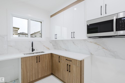 4113 67 Street, Beaumont, AB - Indoor Photo Showing Kitchen With Double Sink