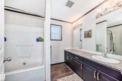 Office space featuring light colored carpet, a textured ceiling, and crown molding - 