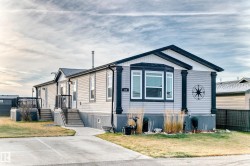 Rear view of property with a yard - 