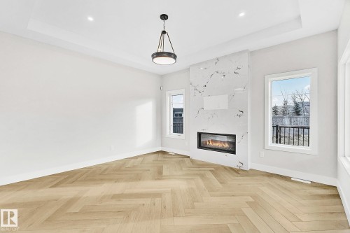221 Kettyl Court, Leduc, AB - Indoor Photo Showing Living Room With Fireplace