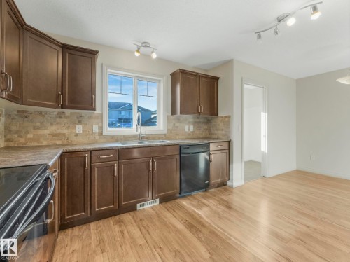 3003 16 Avenue, Edmonton, AB - Indoor Photo Showing Kitchen With Double Sink