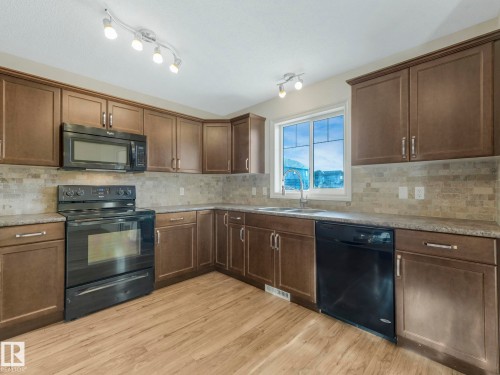 3003 16 Avenue, Edmonton, AB - Indoor Photo Showing Kitchen With Double Sink