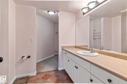 Bathroom with vanity and baseboards - 