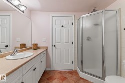 Bathroom with vanity and a stall shower - 