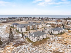 Snowy aerial view with a view of apartment building / complex - 