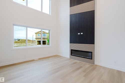 811 Elderberry Court, Edmonton, AB - Indoor Photo Showing Other Room With Fireplace
