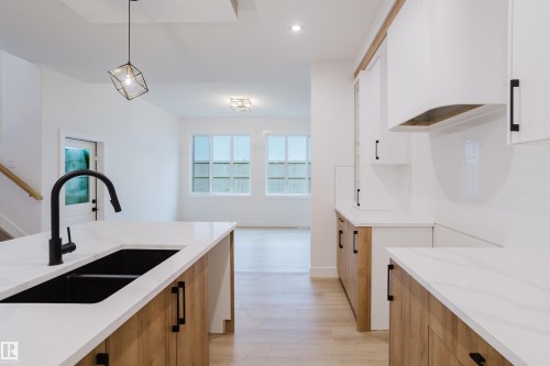1568 Siskin Link, Edmonton, AB - Indoor Photo Showing Kitchen With Double Sink