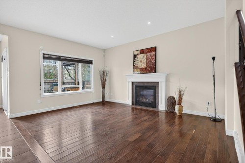 7915 18 Ave Sw, Edmonton, AB - Indoor Photo Showing Living Room With Fireplace