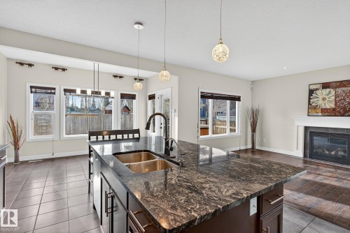 7915 18 Ave Sw, Edmonton, AB - Indoor Photo Showing Kitchen With Fireplace With Double Sink With Upgraded Kitchen