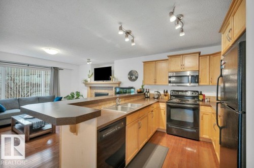 7620 11 Avenue, Edmonton, AB - Indoor Photo Showing Kitchen With Double Sink