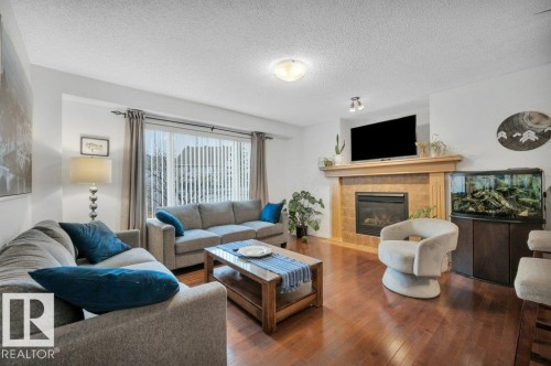 7620 11 Avenue, Edmonton, AB - Indoor Photo Showing Living Room With Fireplace