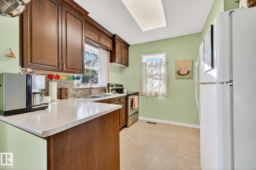 7707 111 Street, Edmonton, AB - Indoor Photo Showing Kitchen With Double Sink