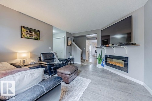 7386 Edgemont Way, Edmonton, AB - Indoor Photo Showing Living Room With Fireplace