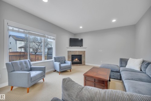 861 Southfork Green, Leduc, AB - Indoor Photo Showing Living Room With Fireplace