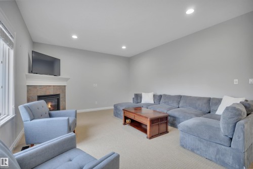 861 Southfork Green, Leduc, AB - Indoor Photo Showing Other Room With Fireplace