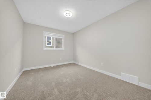575 Reynalds Wynd S, Leduc, AB - Indoor Photo Showing Other Room