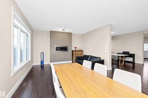3856 Agar Green, Edmonton, AB - Indoor Photo Showing Dining Room With Fireplace