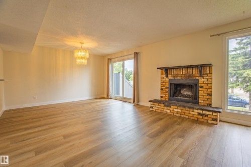 5388 38A Avenue, Edmonton, AB - Indoor Photo Showing Living Room With Fireplace