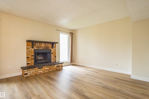 5388 38A Avenue, Edmonton, AB - Indoor Photo Showing Living Room With Fireplace
