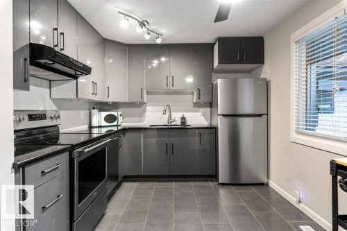 66 Forest Grove, St. Albert, AB - Indoor Photo Showing Kitchen With Stainless Steel Kitchen With Upgraded Kitchen