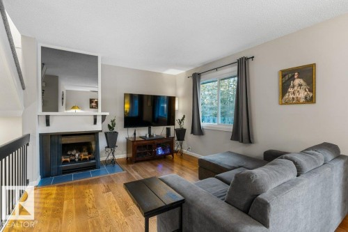 66 Forest Grove, St. Albert, AB - Indoor Photo Showing Living Room With Fireplace