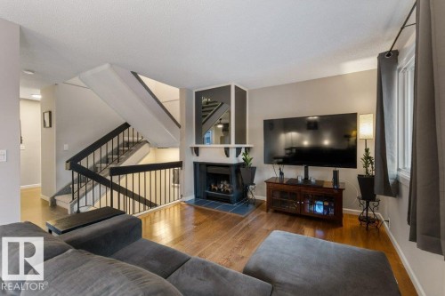 66 Forest Grove, St. Albert, AB - Indoor Photo Showing Living Room With Fireplace