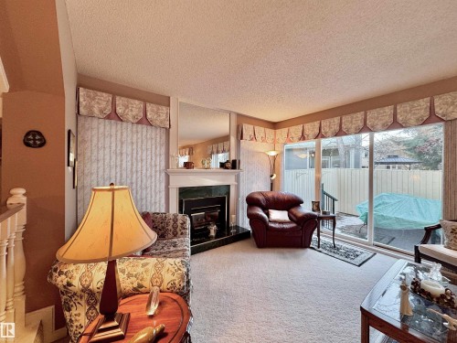 1057 109 Street, Edmonton, AB - Indoor Photo Showing Living Room With Fireplace