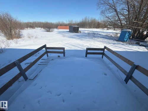 The property features a fenced area and an expansive yard - 4904 51 Avenue, Opal, AB - Outdoor With View